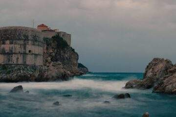 fortification on cliff washed by azure seawater