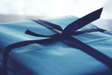 close up photo of tied blue box